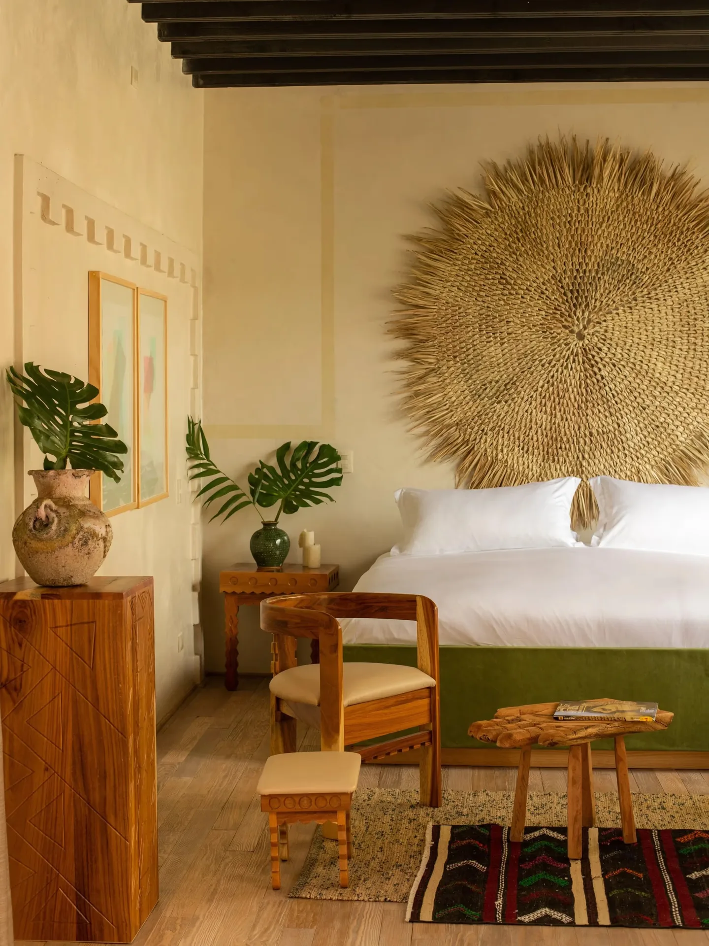 Charming suite with a monumental natural fiber wall art at La Valise San Miguel Hotel.